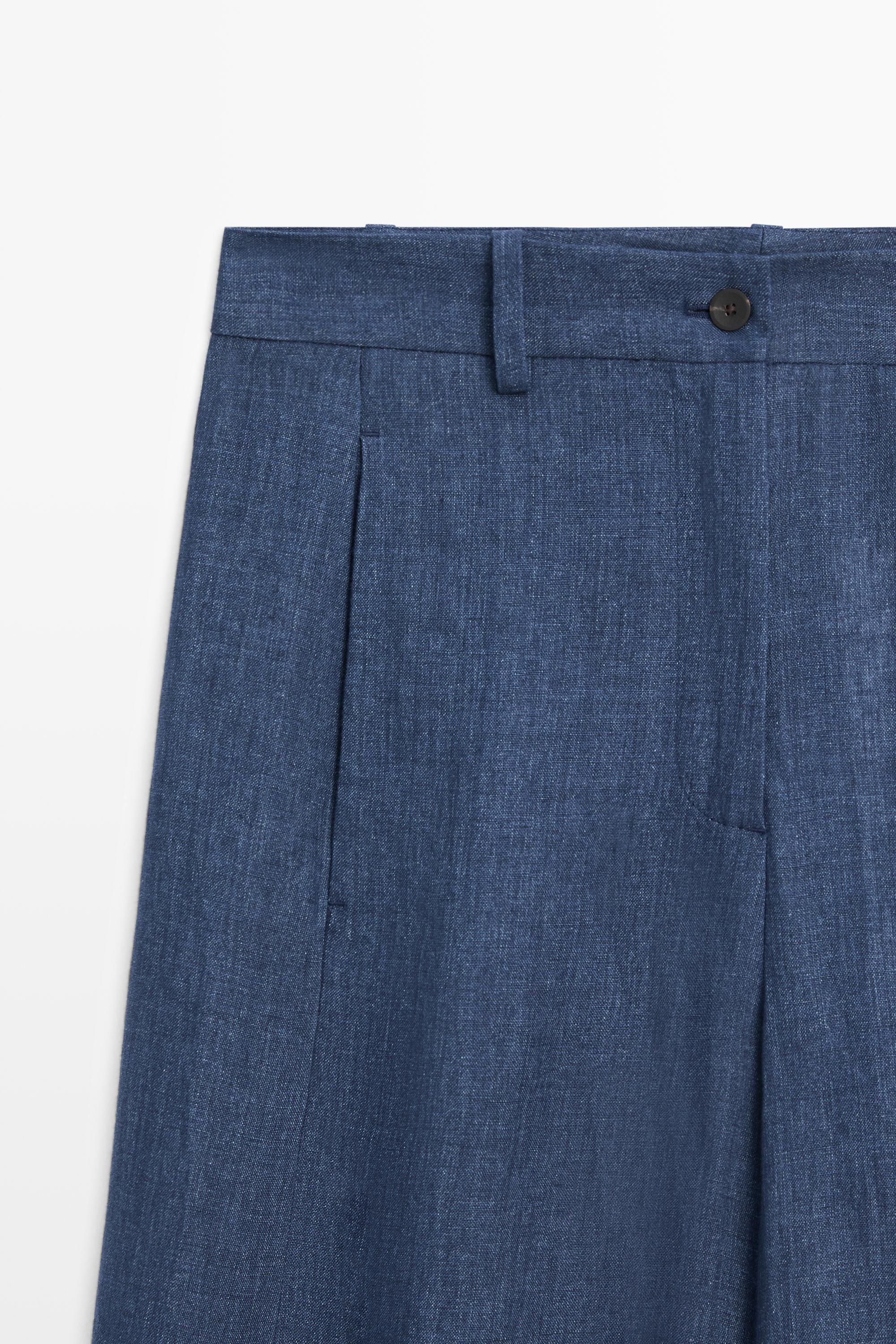 Total look linen pants with buttoned hems